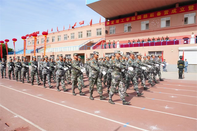 米乐mile官方网站隆重举行“国防后备营”成立暨授旗仪式